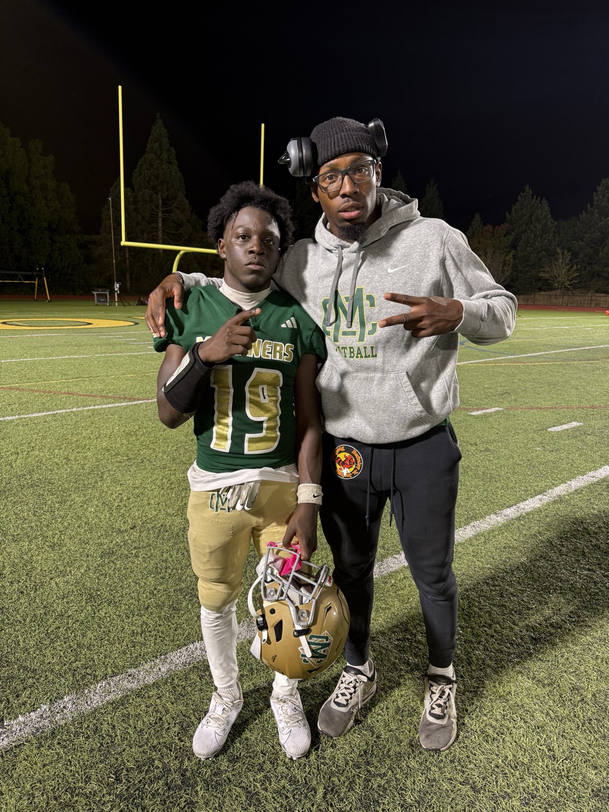 Coach Trammell with an athlete after a game